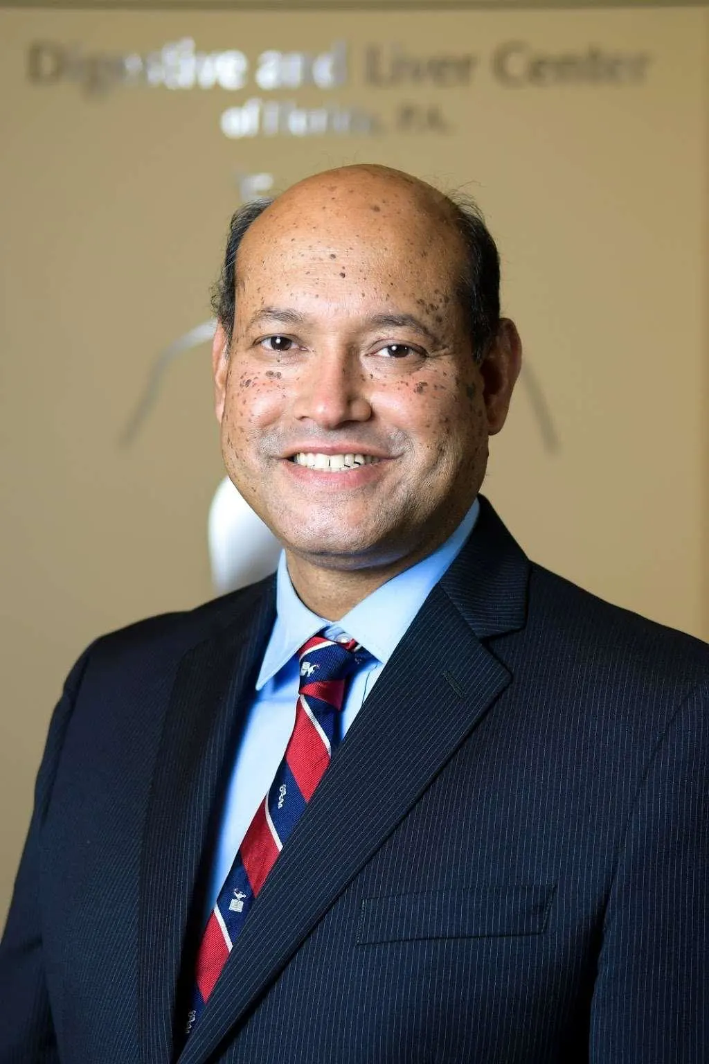 DR. BASHER M. ATIQUZZAMAN